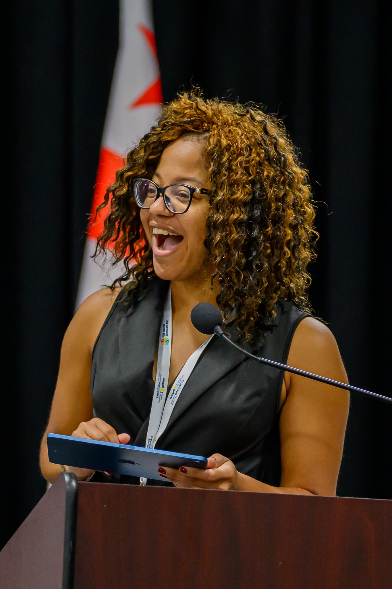 Kellina Powell presenting on stage